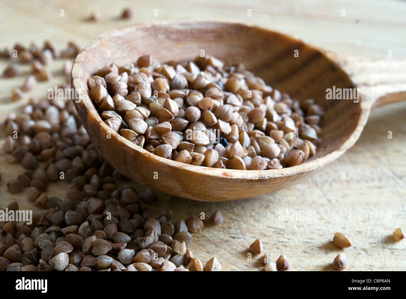 buckwheat in a wooden spoon. Close-up. Stock Photo