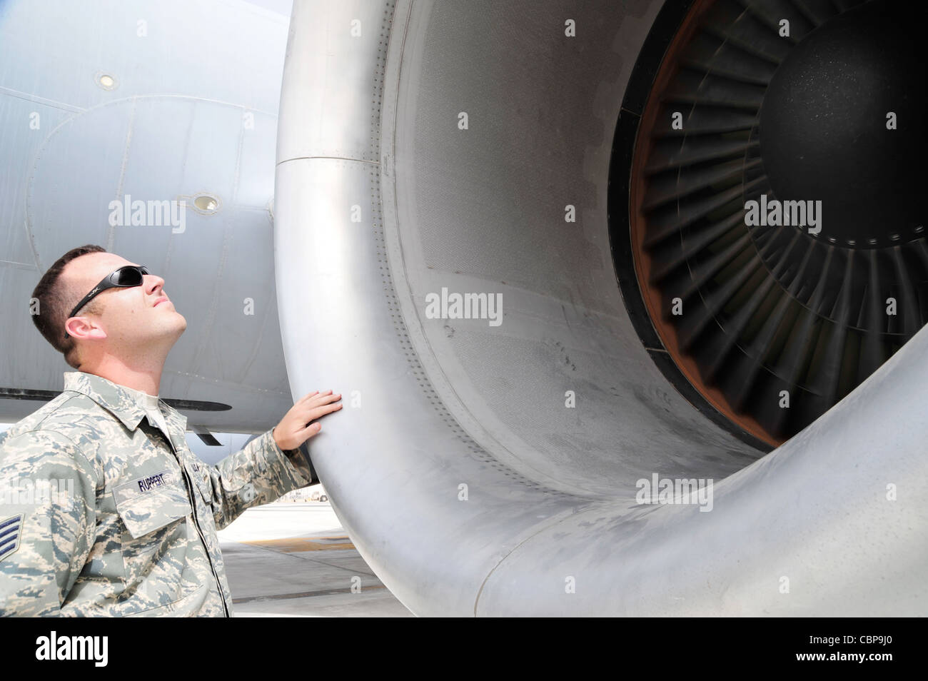 Staff Sgt. Michael Ruppert inspects the rivets around a KC-10 Extender ...