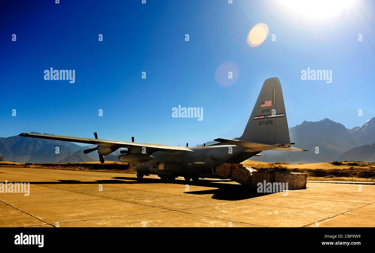 A C-130 Hercules is positioned to unload humanitarian aid supplies Oct. 3, 2010, at Skardu Airfield, Pakistan. U.S. military aircrews, worked in close coordination with the Pakistan military, transported more than 6.6 million kilograms of relief supplies and evacuated 21,000 people in the flood-affected regions of Pakistan during August and September. Stock Photo