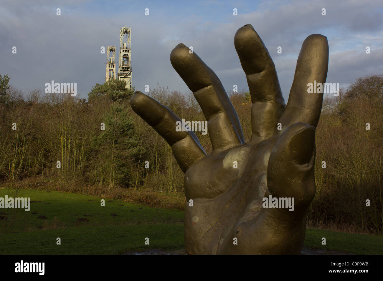 Clipstone pit headstock behind a golden hand Stock Photo Alamy