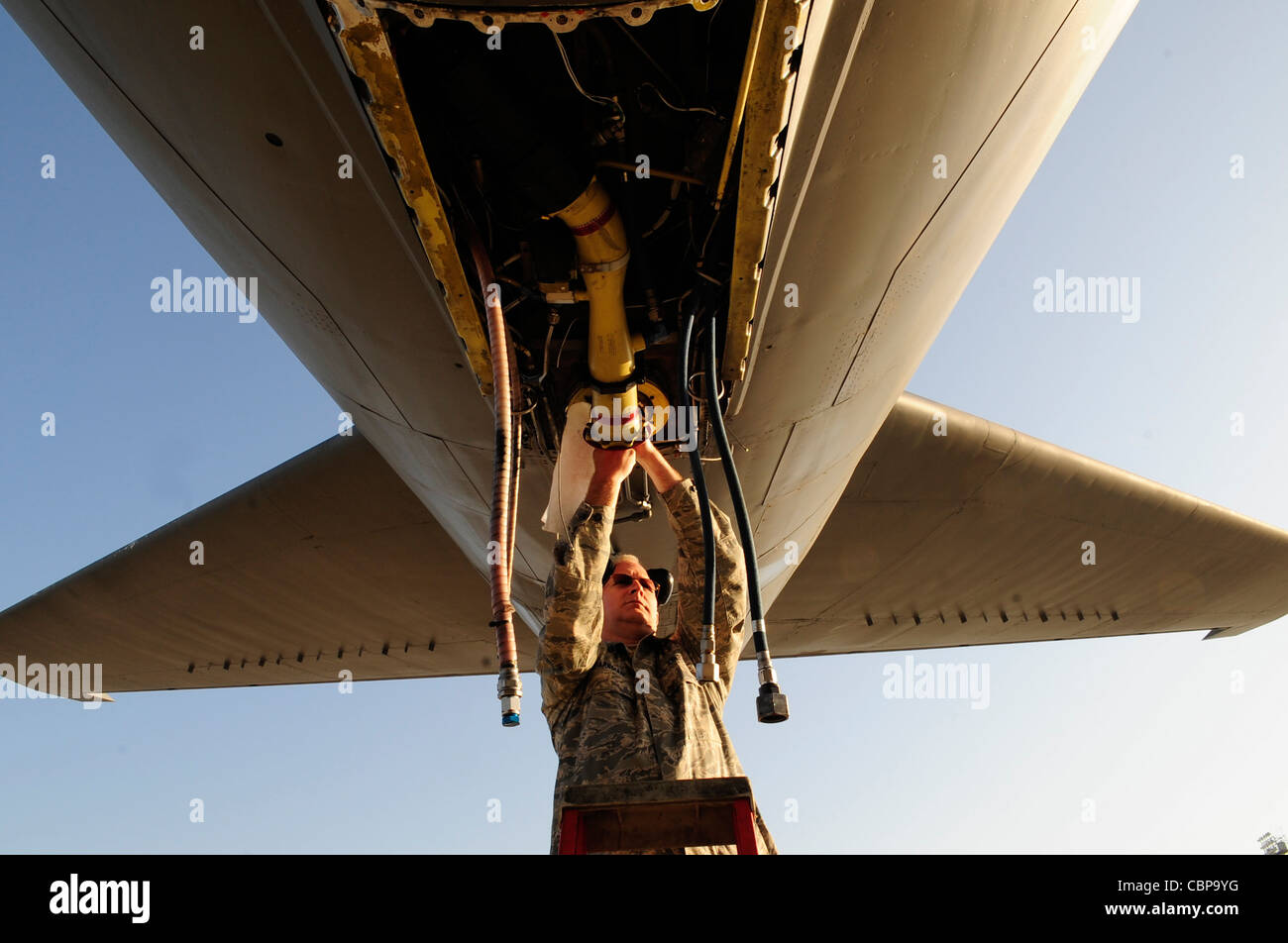 WESTERN EUROPE (April 12, 2011) -- Tech. Sgt. David Sparkman, 171st Air Refueling Wing non -destructive inspection inspector, cleans off the boom strut of a KC-135 Stratotanker to prepare it for a magnetic particle inspection. A member of the Pennsylvania Air National Guard, Sergeant Sparkman is deployed with 313th Air Expeditionary Wing supporting Operation Unified Protector, a NATO-led mission in Libya, to protect civilians and civilian-populated areas under threat of attack. The 313th AEW provides aerial refueling to U.S. and coalition aircraft with KC-135 Stratotankers and KC-10 Extenders. Stock Photo