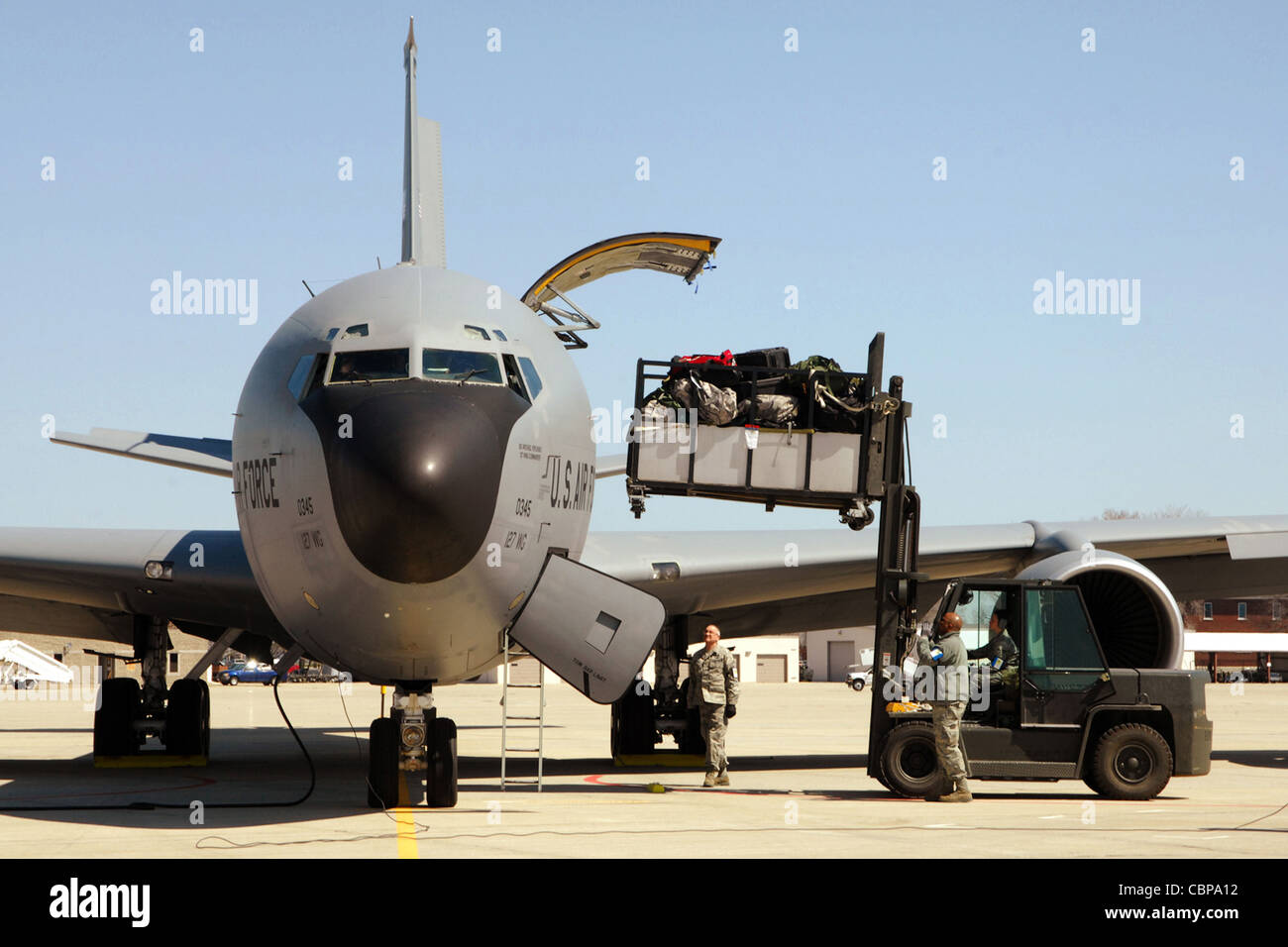 Cargo handlers load a pallet of equipment into a KC-135 Stratotanker April 14, 2011, at Selfridge Air National Guard Base, Mich. Stock Photo