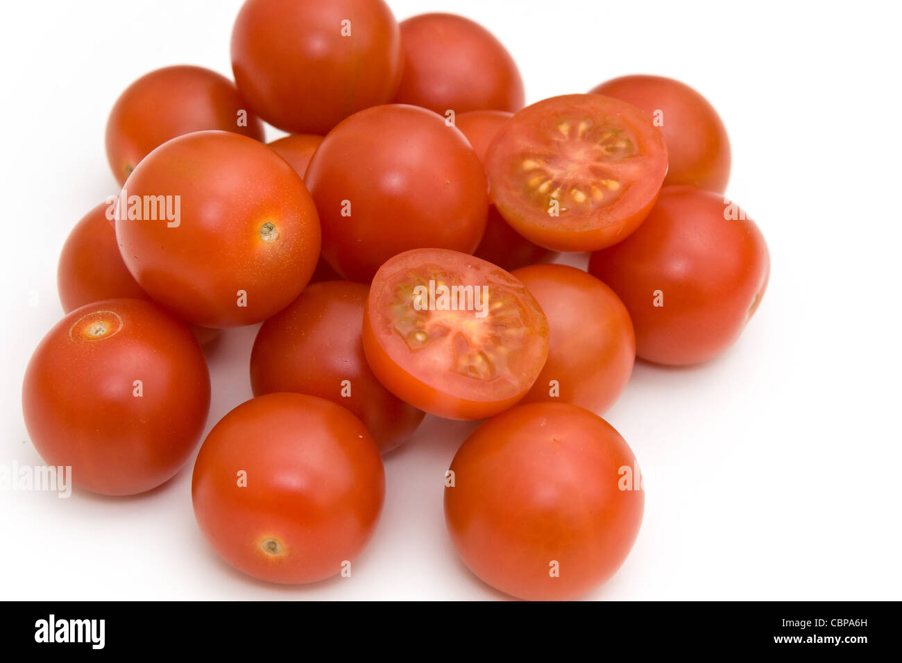 Cherry tomatoes isolated on white Stock Photo - Alamy