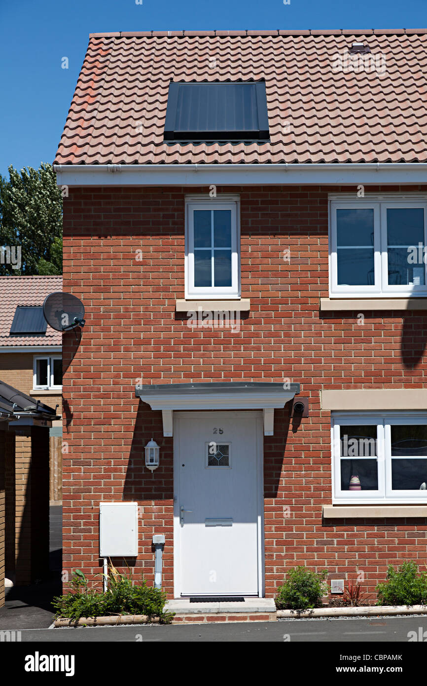 New build Barratt home on new estate with solar water heating panel on