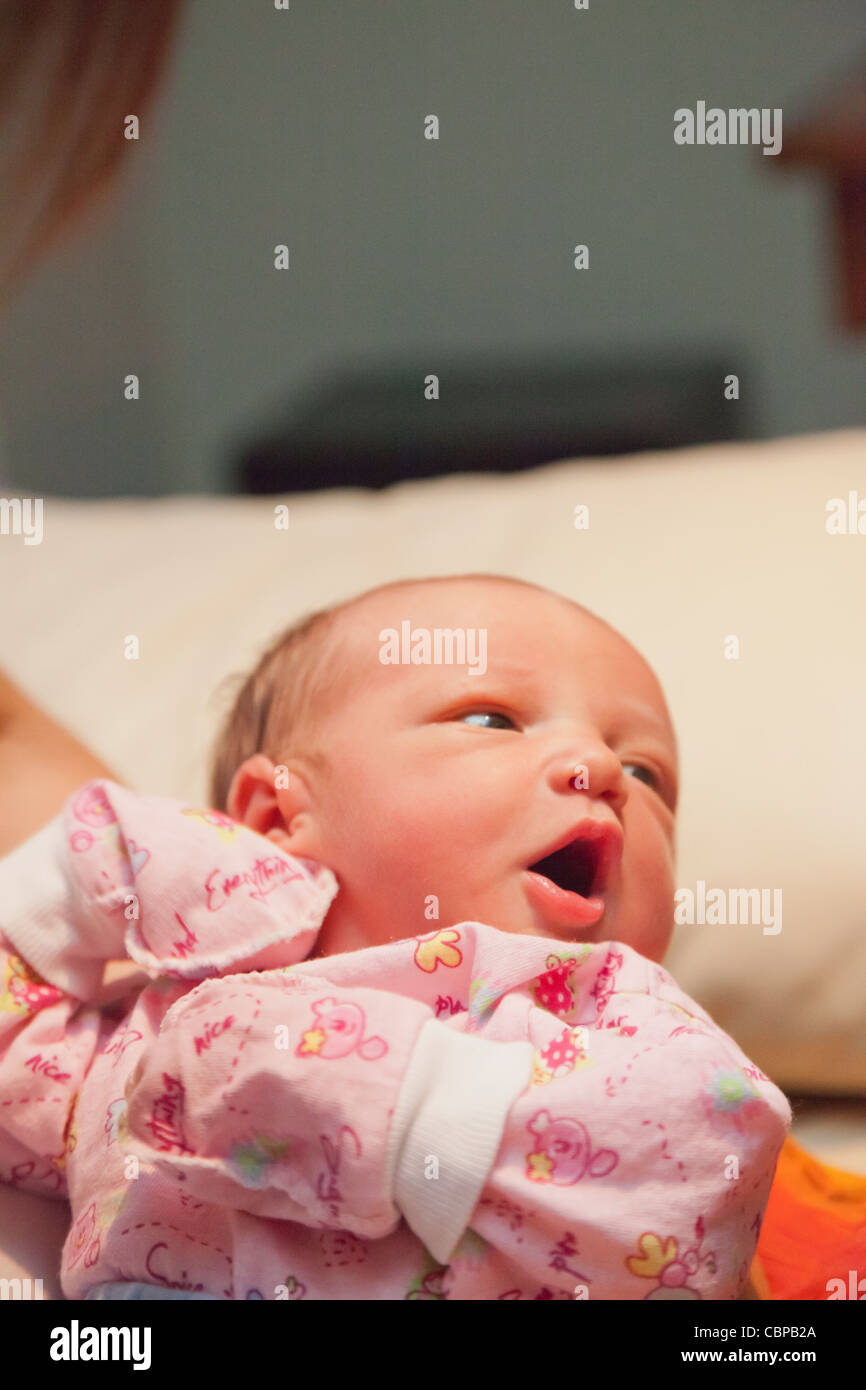 Playing with her mom. First day at home Stock Photo Alamy