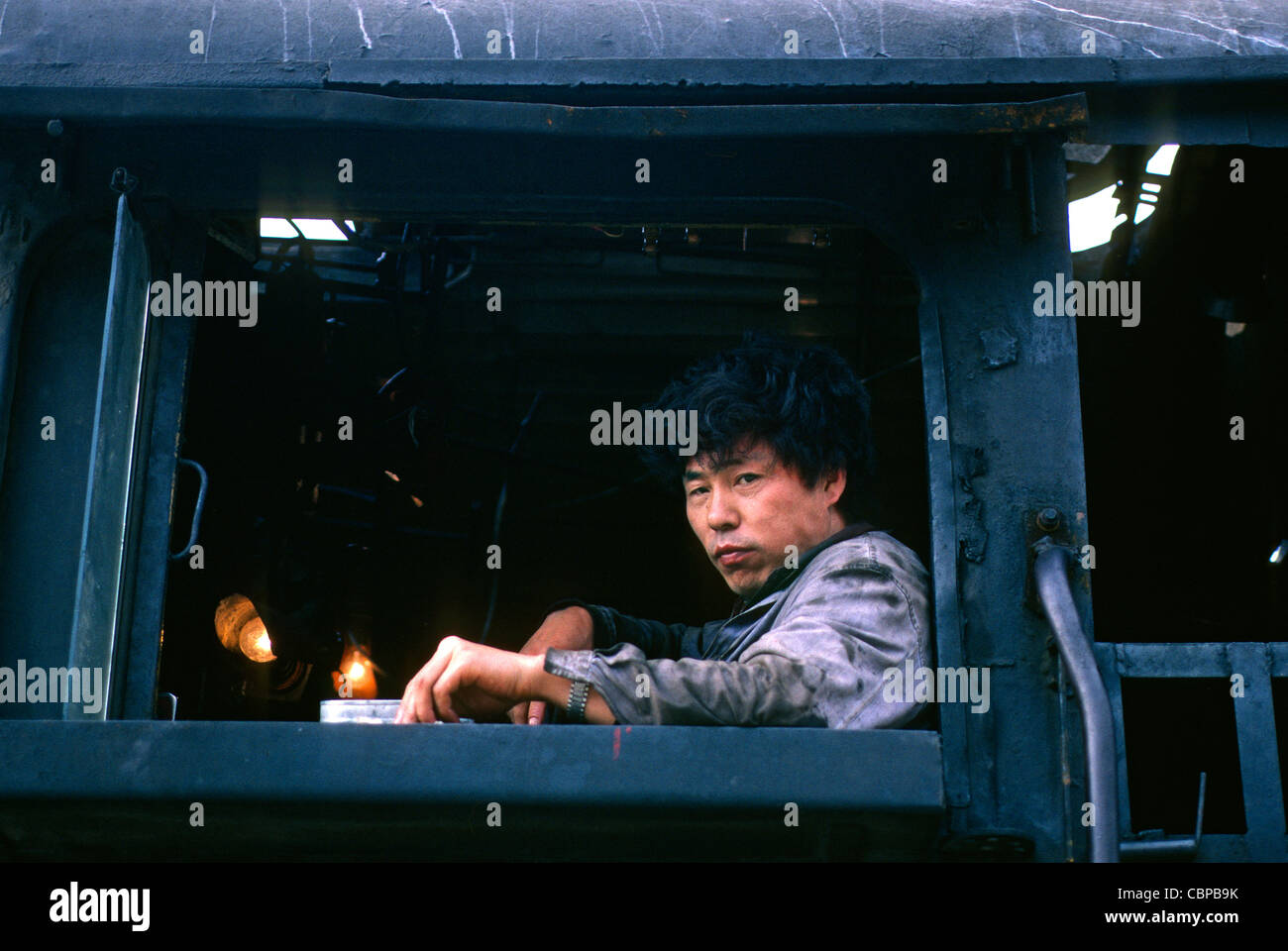Steam train driver Xian Station Shaanxi China Stock Photo