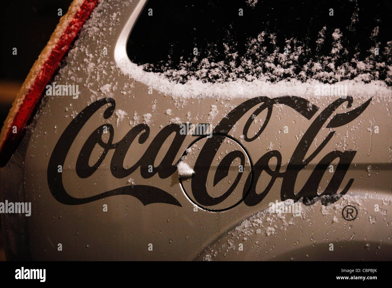 Coca Cola logo and snow in a car Stock Photo