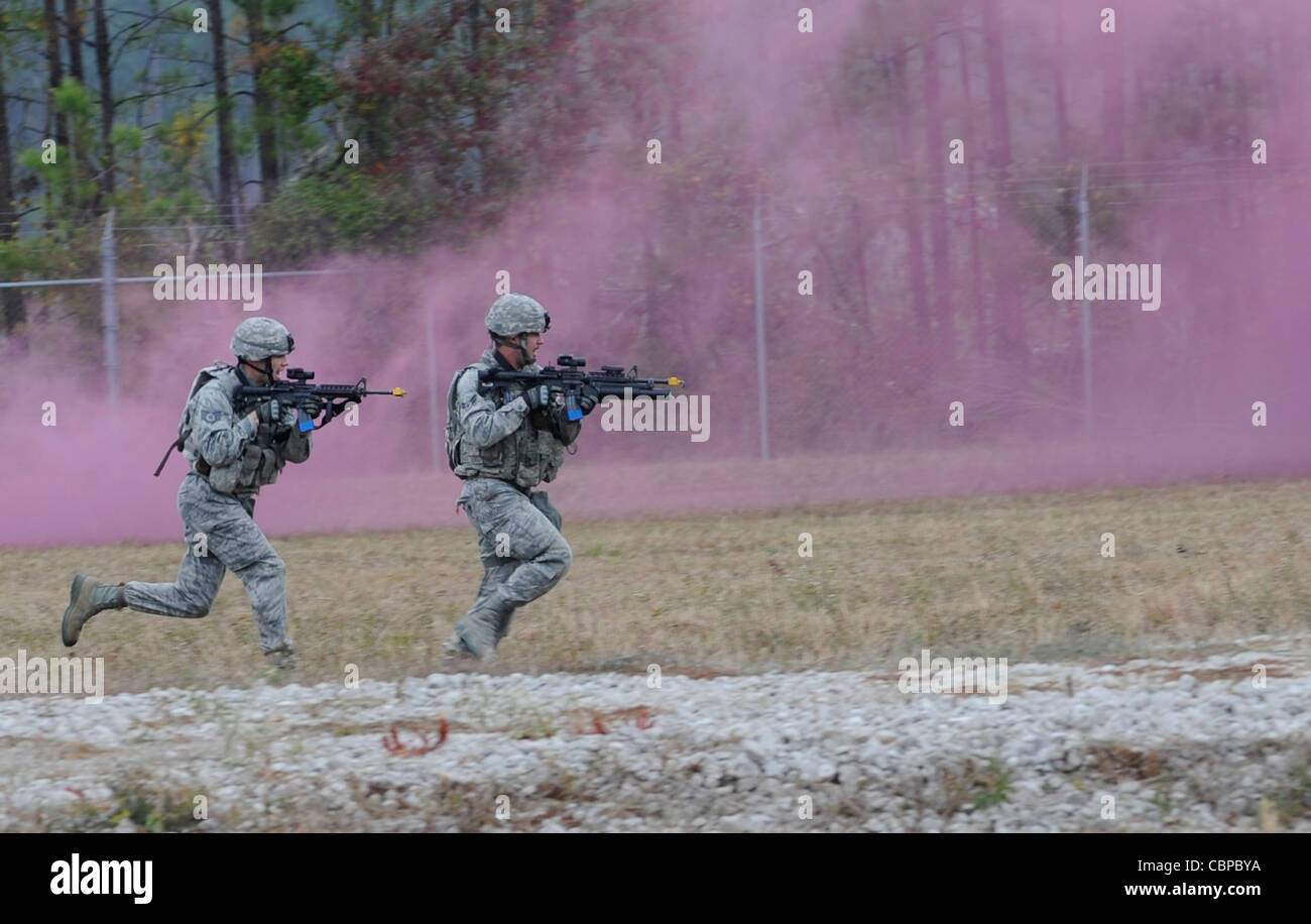 Members of the 509th Security Forces Squadron participate in phase one, the bounding over watch, of the mental and physical challange during the second annual Global Strike Challenge Nov. 7, 2011, at Camp Minden. The competition includes security forces and missile and bomber forces from Air Force Global Strike Command. The teams have the opportunity to participate in innovative thinking, teamwork and esprit de corps that are essential to the mission. Stock Photo