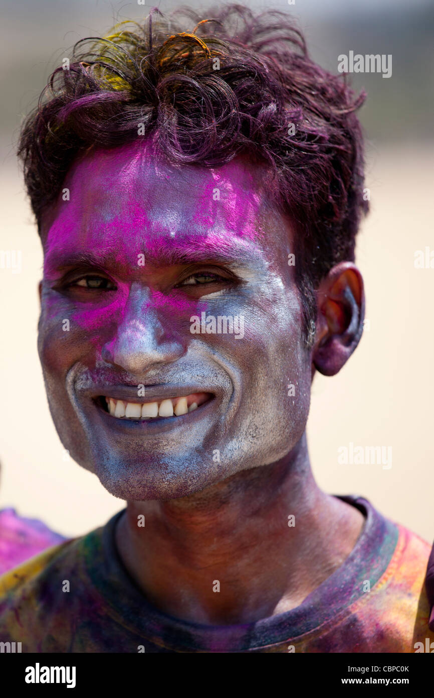 Indian man celebrating annual Hindu Holi festival of colours with powder paints in Mumbai, formerly Bombay, Maharashtra, India Stock Photo