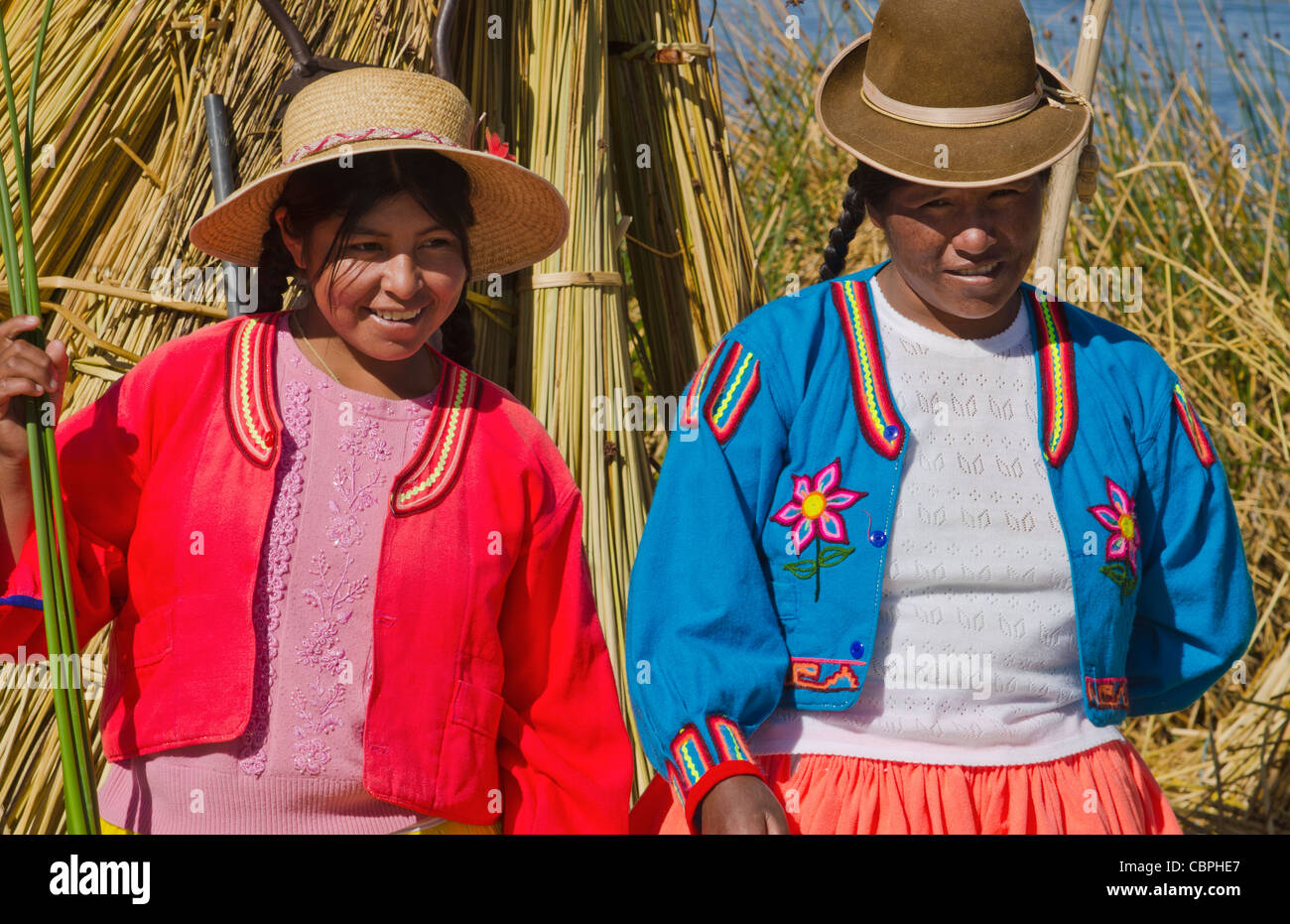 Portrait of young woman in Uros family on floating islands of Lake ...