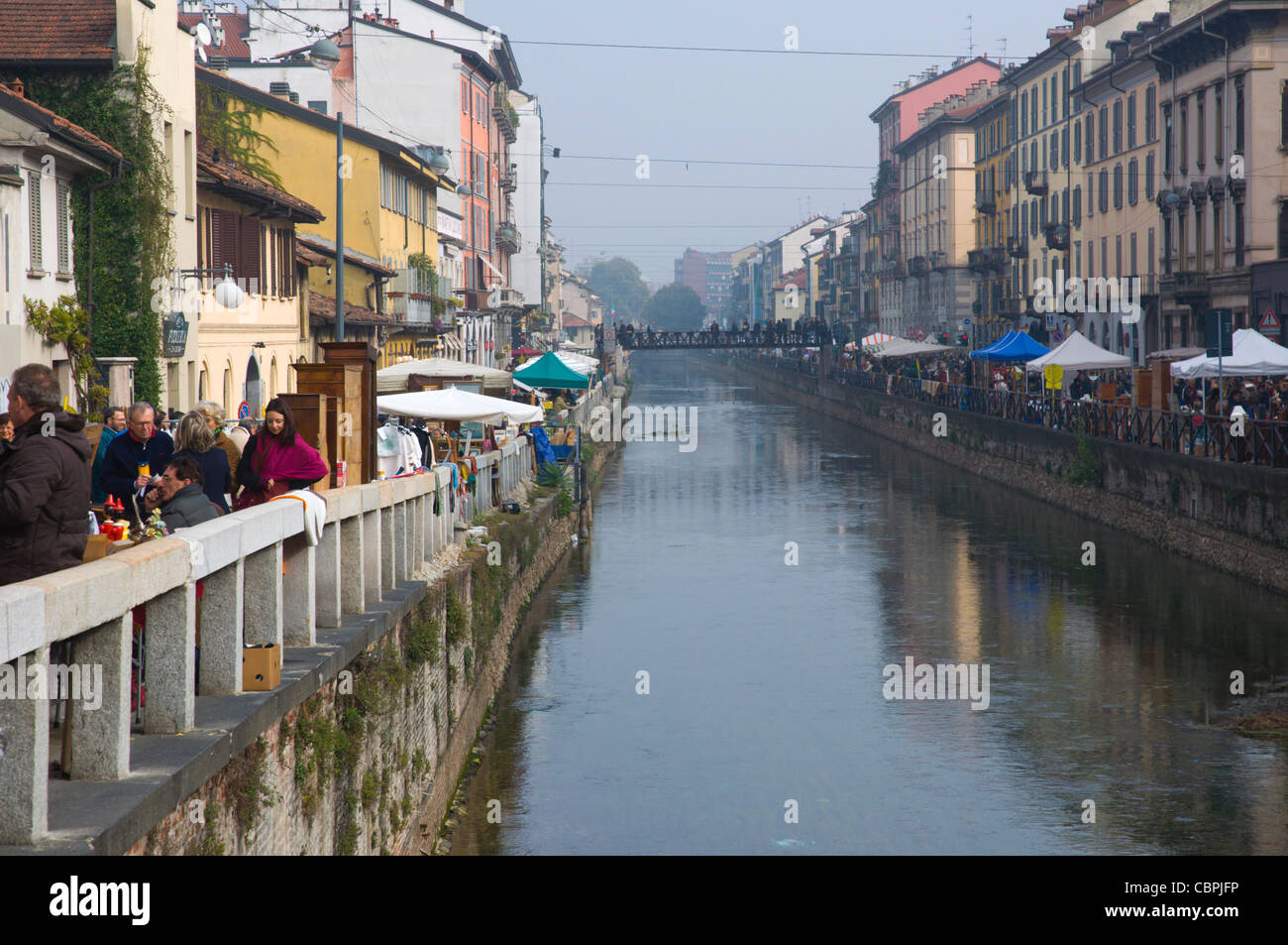 Canalside streets during antiques market on last sunday of month Navigli district Milan Lombardy region Italy Europe Stock Photo