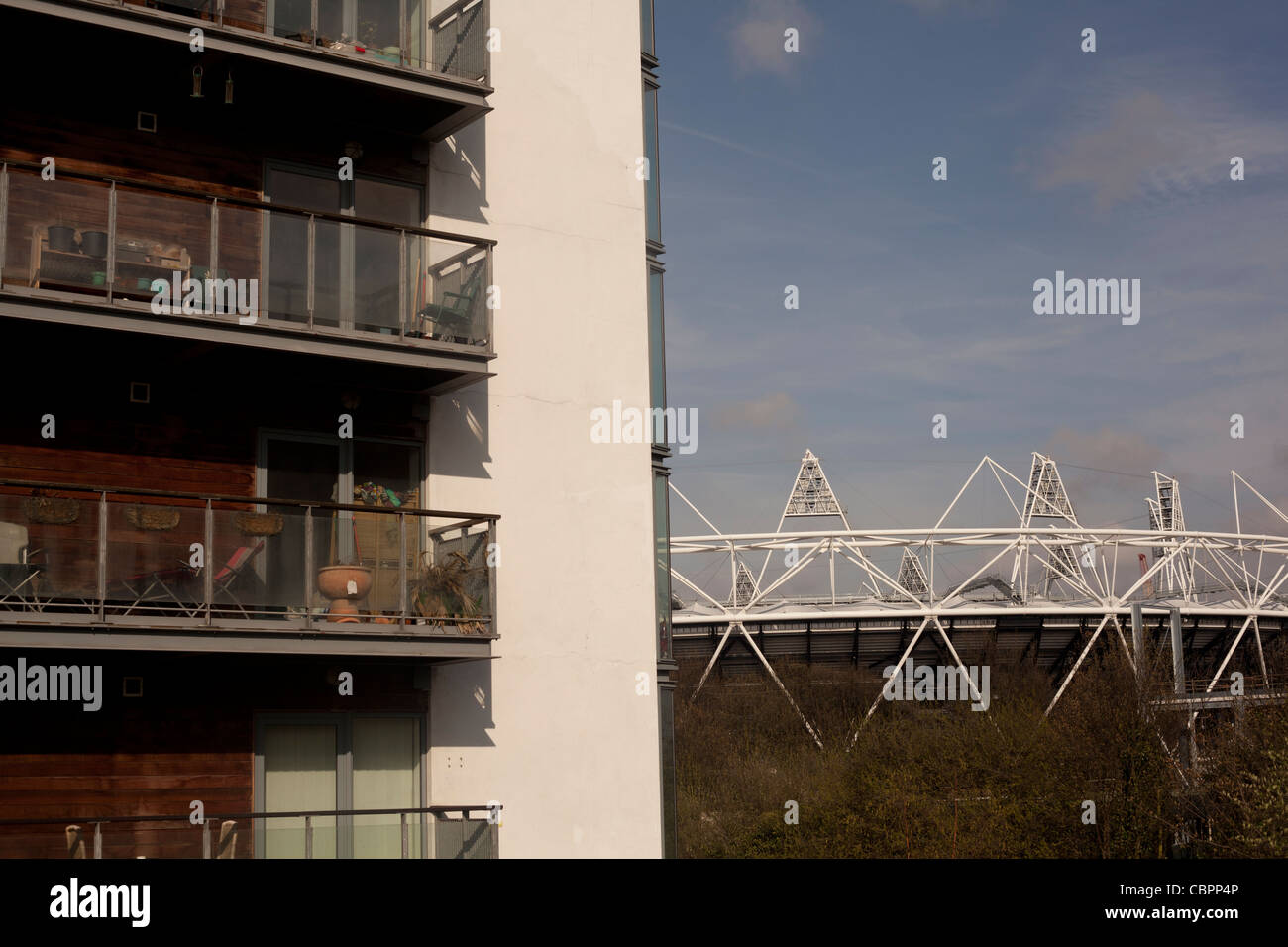 The 2012 Olympic Stadium is seen from behind a new build of Luxury