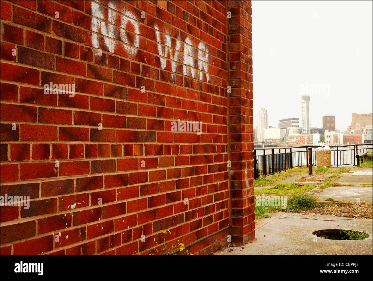 No war graffiti on a wall in Birkenhead over the River Mersey from Liverpool, UK Stock Photo