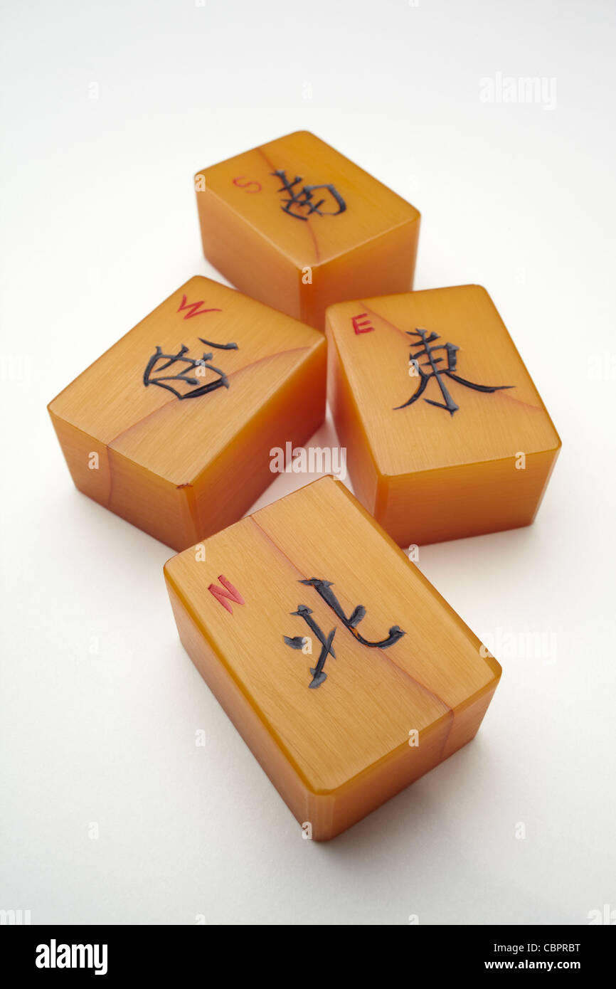 A group of Mahjong tiles, representing the North,South ,East and West winds. Stock Photo