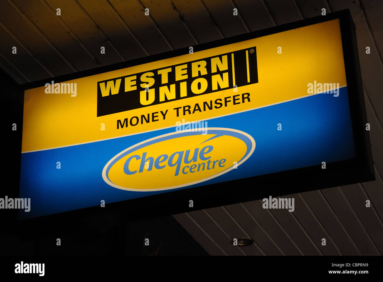 Western Union illuminated sign. Stock Photo