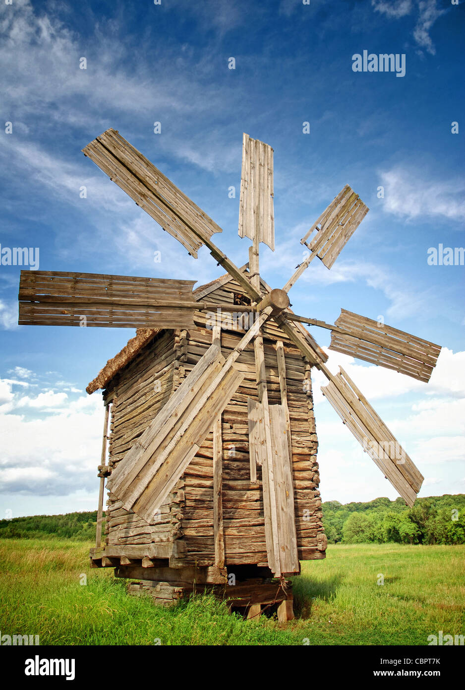 Old Windmills in a green fields Stock Photo