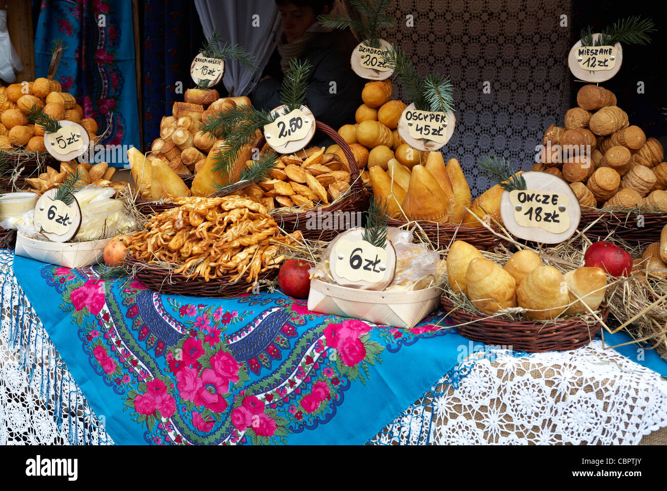 Poland Krakow Oscypki Stall at Christmas Market Smoked Sheep and Cow Cheese Products from Tatra Mountains Region Stock Photo