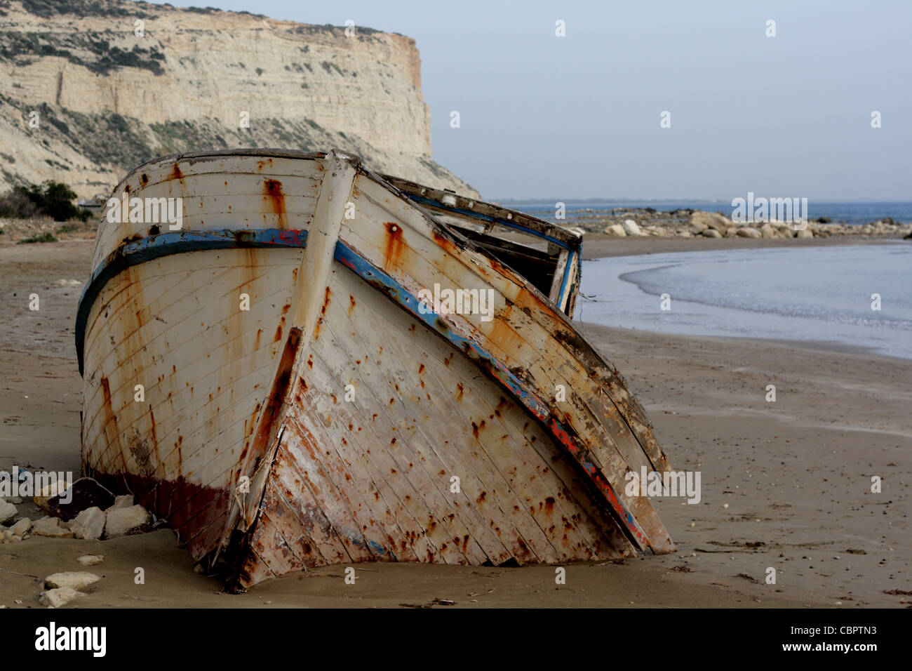 An old Cypriot fising boat sunk in to the sands, Cyprus Stock Photo - Alamy