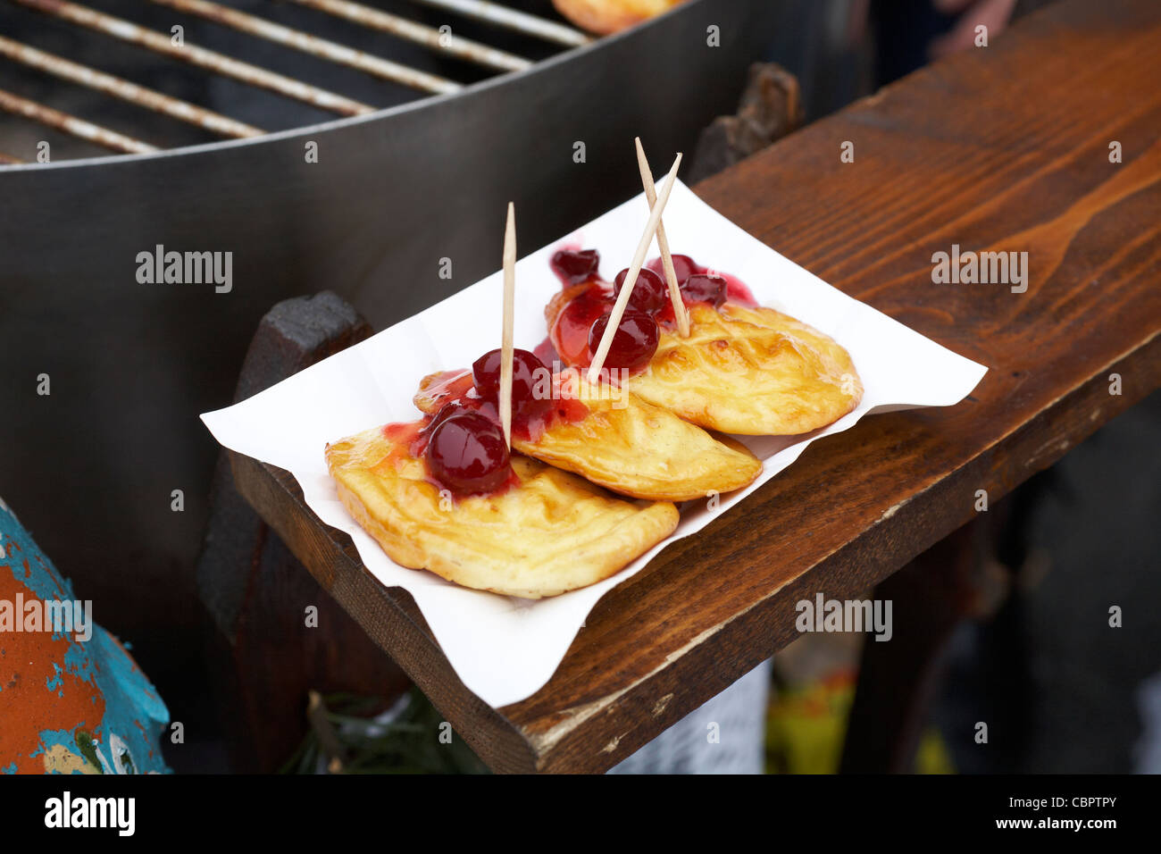 Poland Krakow Christmas Market Stall selling Oscypek traditional smoked sheep cheese Stock Photo