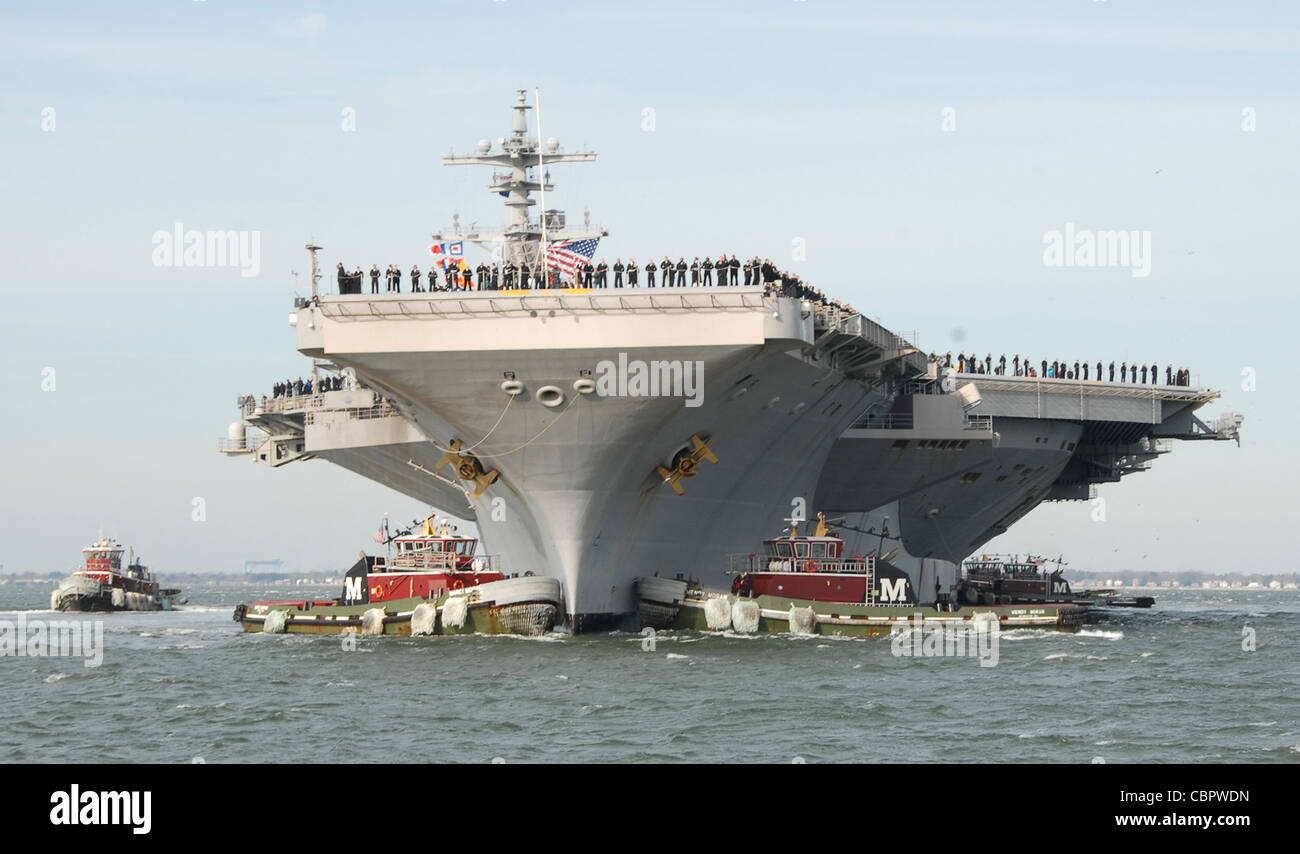 NORFOLK (Dec. 10, 2011) The aircraft carrier USS George H.W. Bush (CVN 77) pulls into Naval Station Norfolk following a seven-month deployment to the U.S. 5th and 6th Fleet areas of responsibility. Stock Photo
