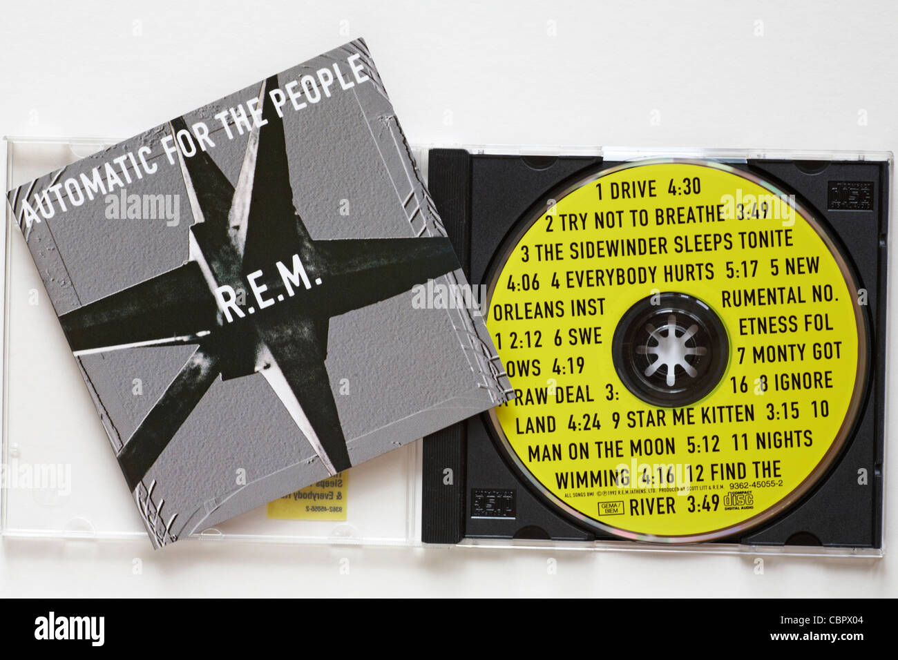 R.E.M. CD Automatic for the people with case open to show disc and tracks  set on white background Stock Photo - Alamy