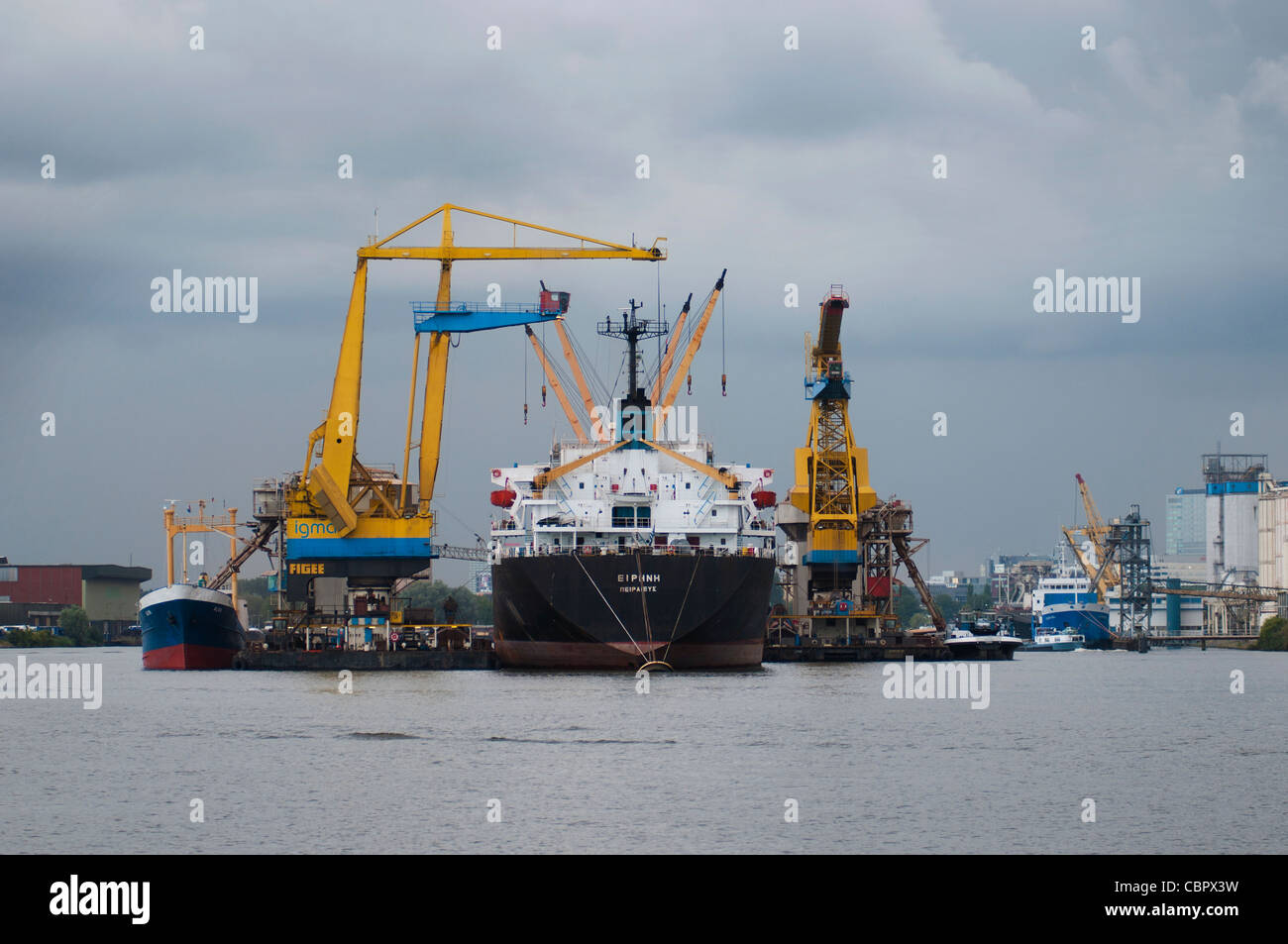 transfer in harbour of Amsterdam, cranes, productivity, economy Stock Photo