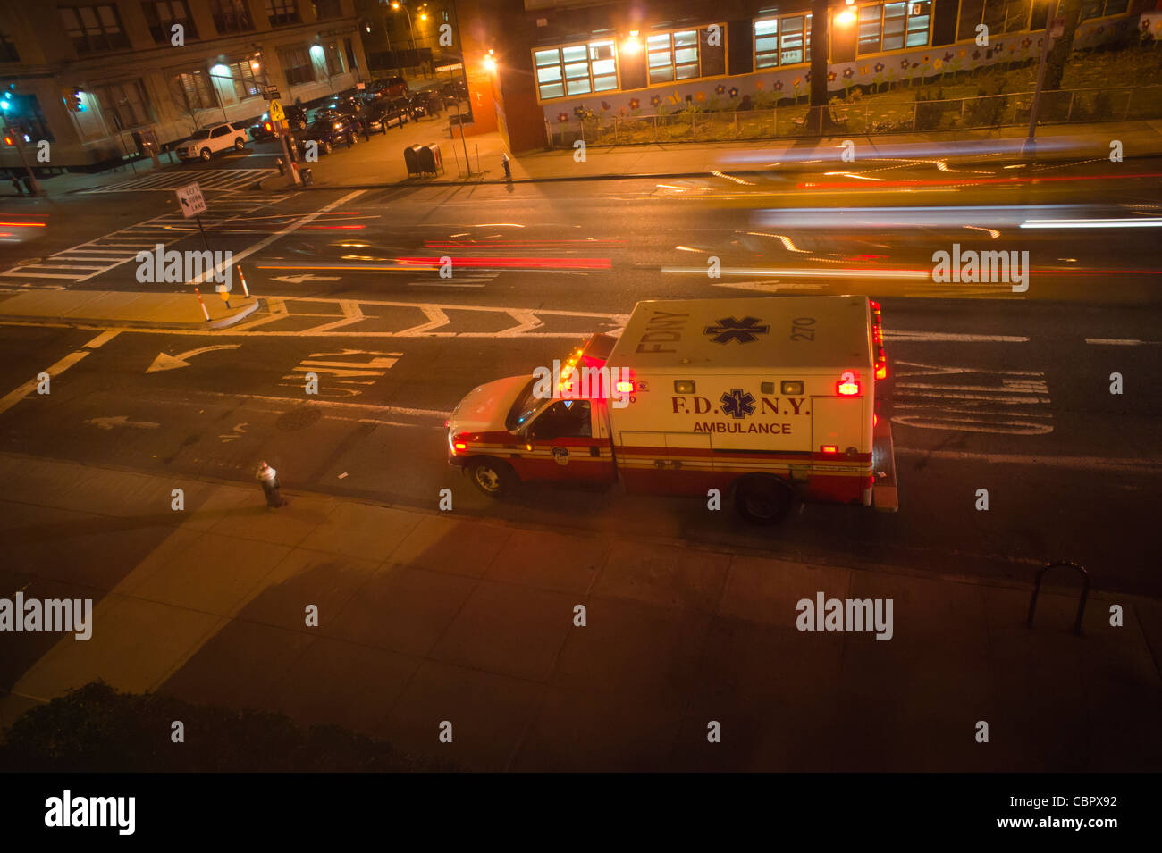 An FDNY ambulance is parked outside an apartment building Stock Photo