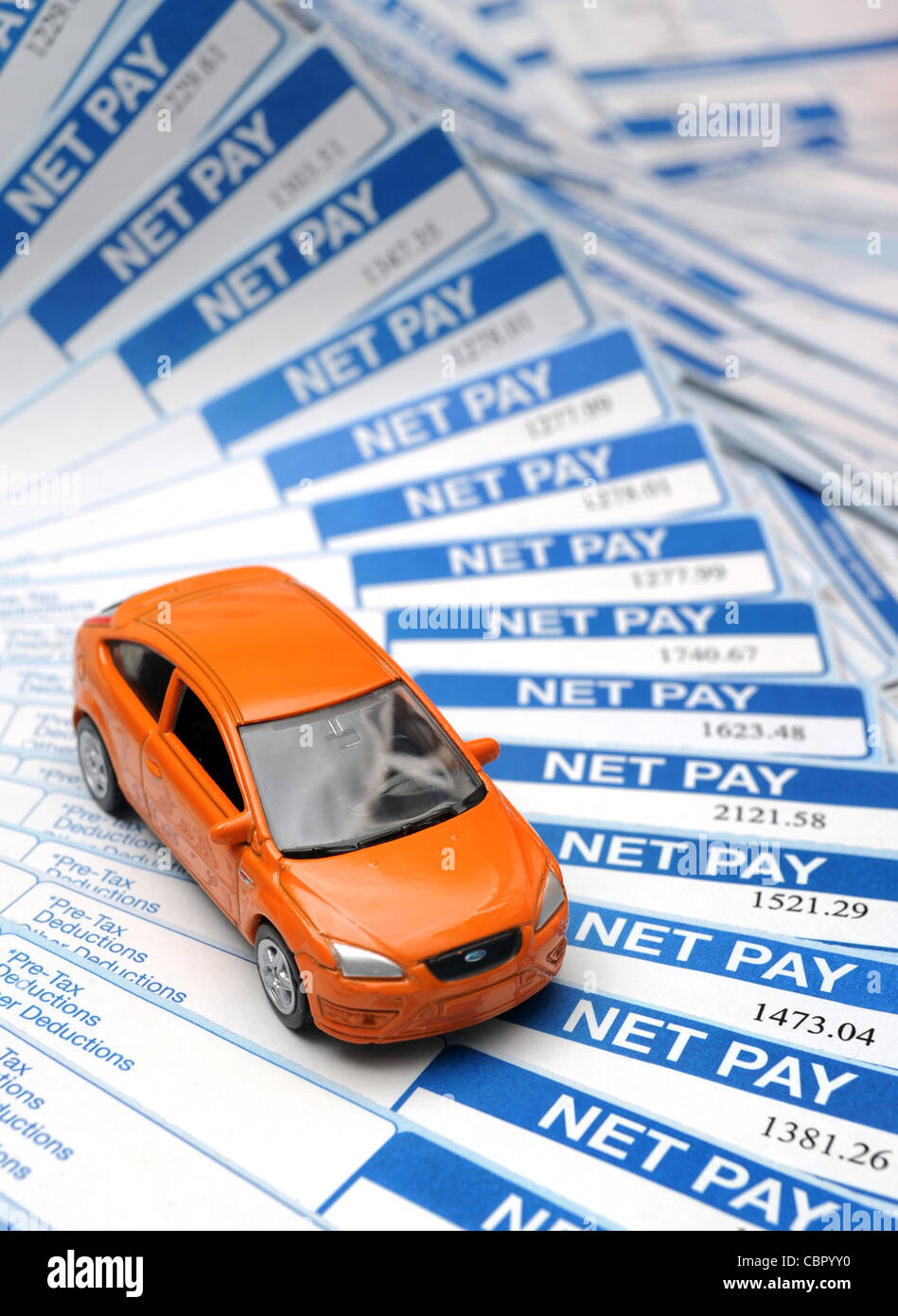 BRITISH PAYSLIPS WITH MODEL CAR RE INCOMES WAGES JOBS RISING INFLATION BILLS HOUSEHOLD BUDGETS SALARIES NET PAY MONEY ETC UK Stock Photo