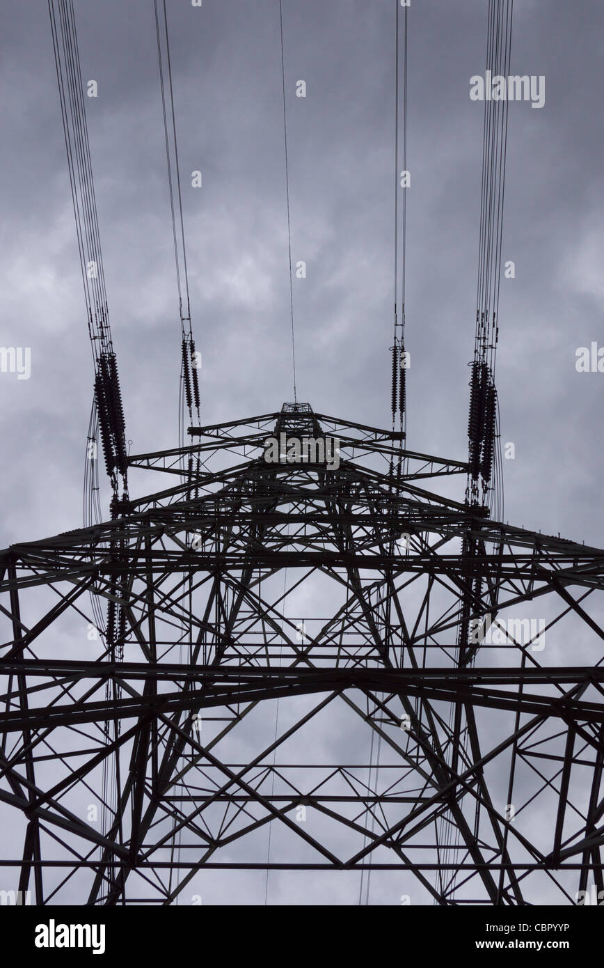 Silhouette of electricity pylon set against a cloudy Sky Stock Photo ...