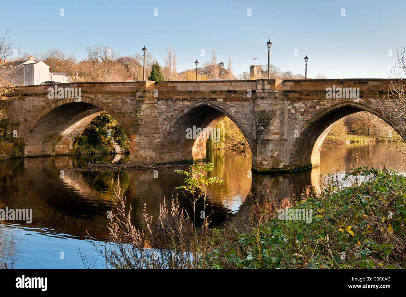Road bridge at Yarm from the riverside path, autumn scene with reflections in River Tees Stock Photo