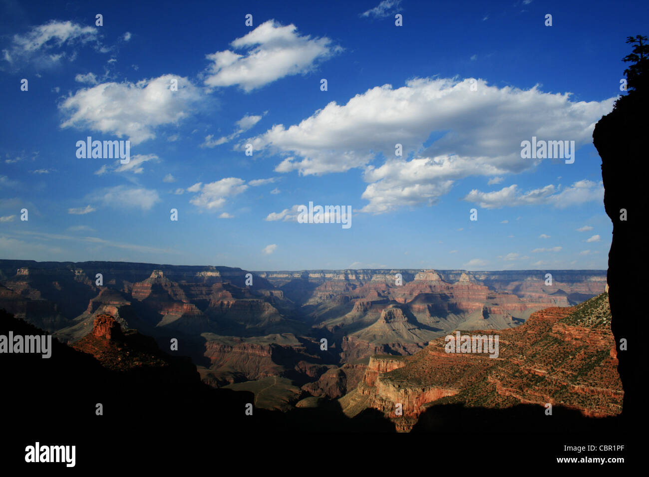 the Grand Canyon in the late afternoon from the Bright Angel Trail framed by shadows and silhouetted cliffs Stock Photo
