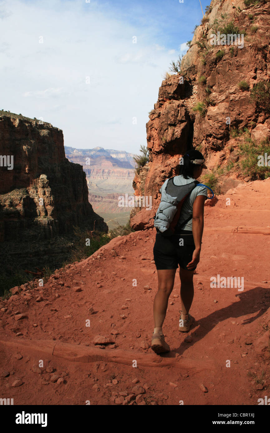 a woman day hiking on the Bright Angel trail in the Grand Canyon, Arizona Stock Photo