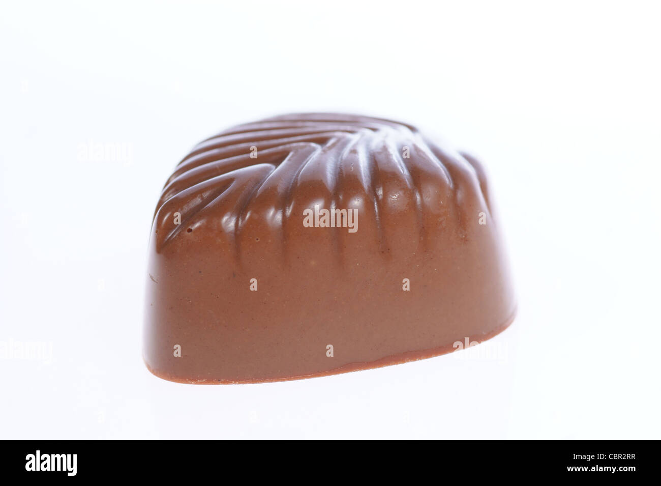 chocolate praline on white background. Delicious dark and milk