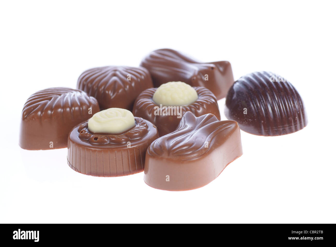 chocolate pralines on white background. Delicious dark and milk