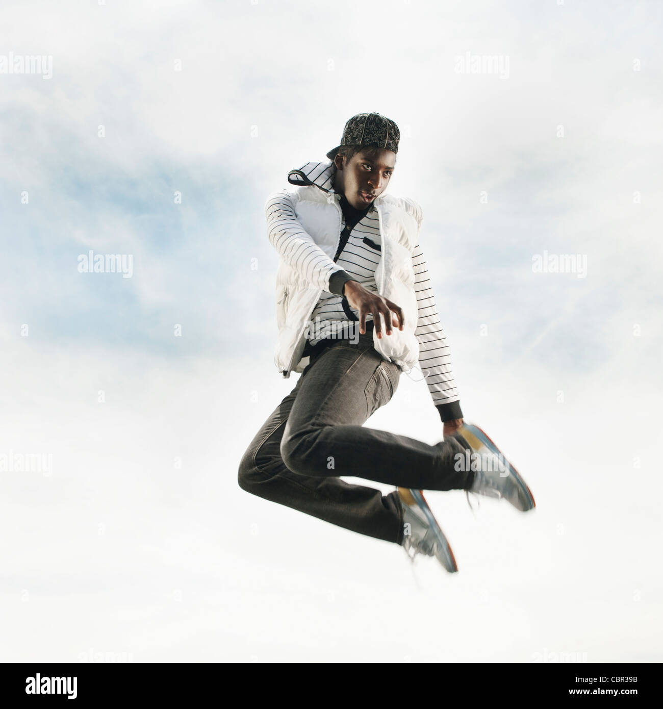 African American jumping in mid-air Stock Photo