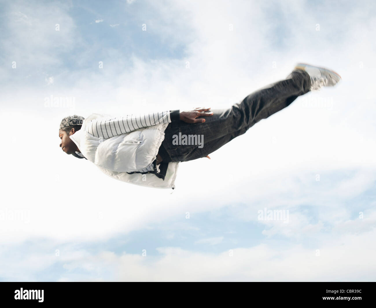 African American man flying through mid-air Stock Photo