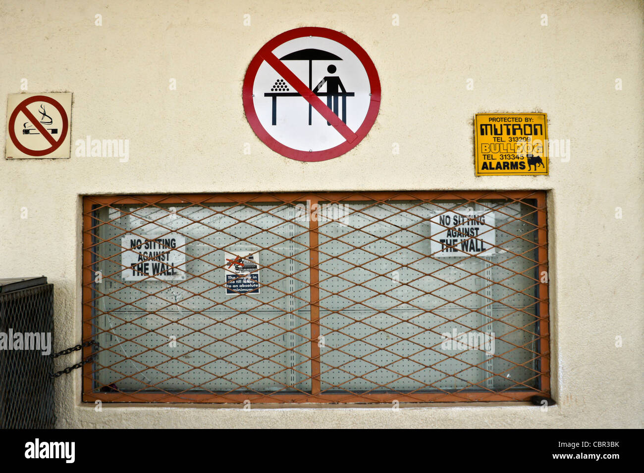 Signs for activities prohibited at gas station in Namibia Stock Photo