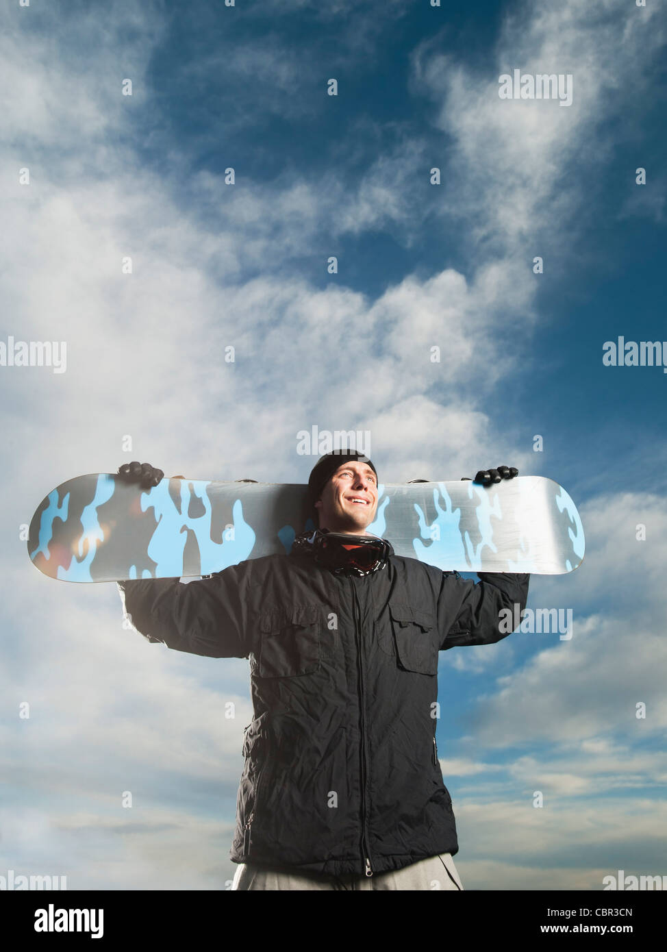 Caucasian man holding snowboard Stock Photo - Alamy
