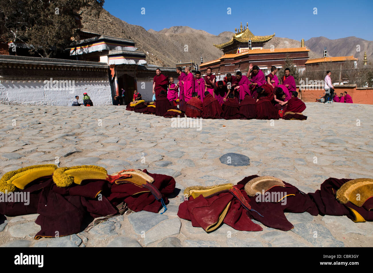 Tibetan Buddhist monks at a ceremony in Labrang monastery. Stock Photo