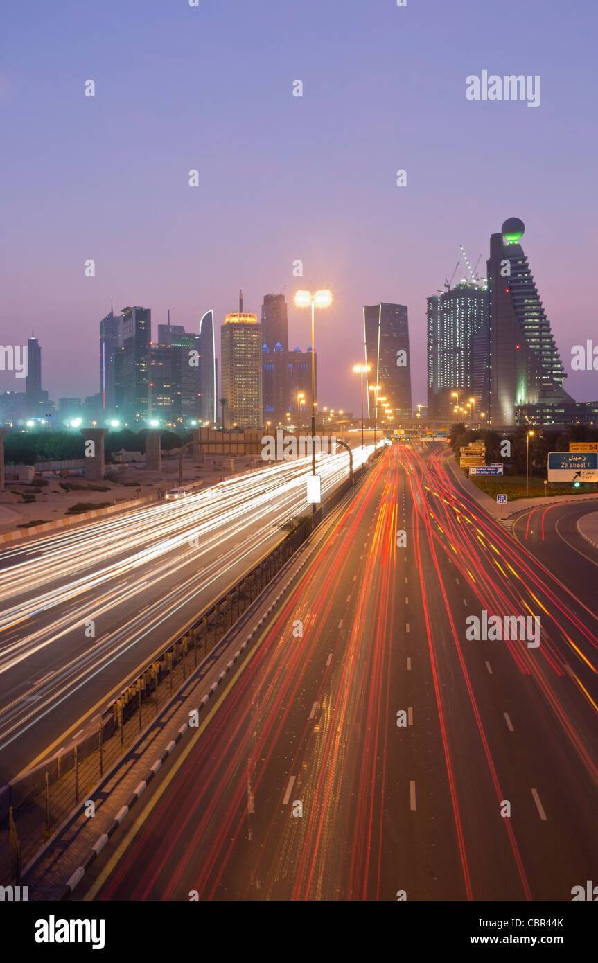 Busy traffic on Sheikh Zayed Road at dusk in Dubai in United Arab Emirates Stock Photo