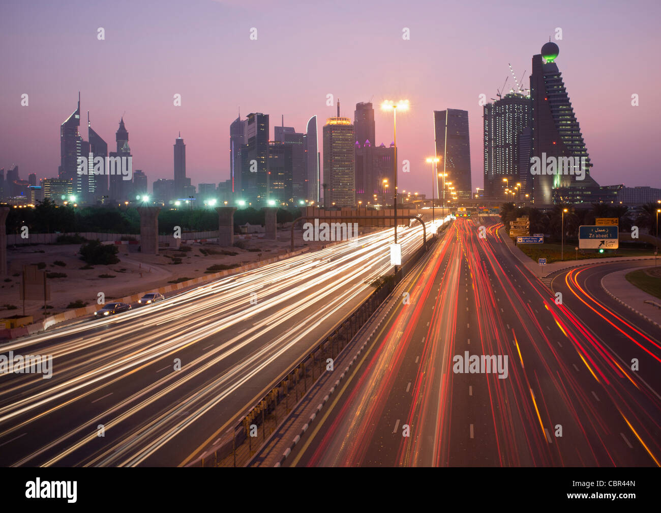 Busy traffic on Sheikh Zayed Road at dusk in Dubai in United Arab Emirates Stock Photo