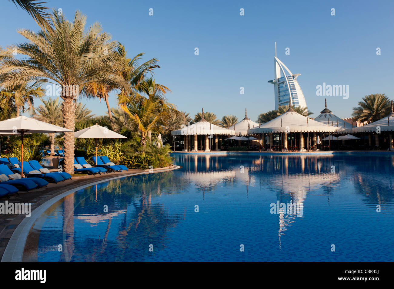 Swimming pool and restaurant pavilions in Al Qasr hotel at Jumeirah Madinat in Dubai in United Arab Emirates Stock Photo