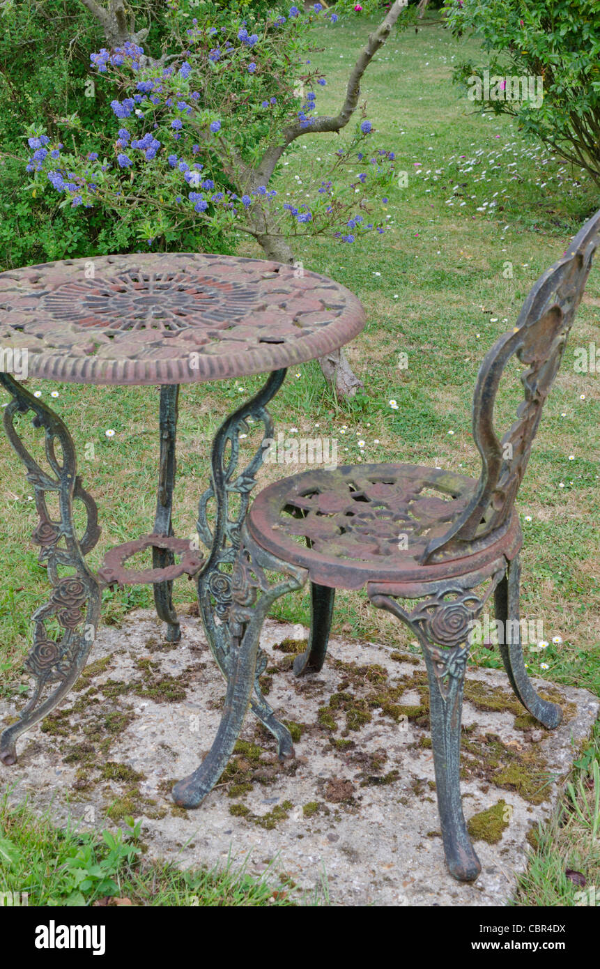 Old garden table and chair Stock Photo Alamy