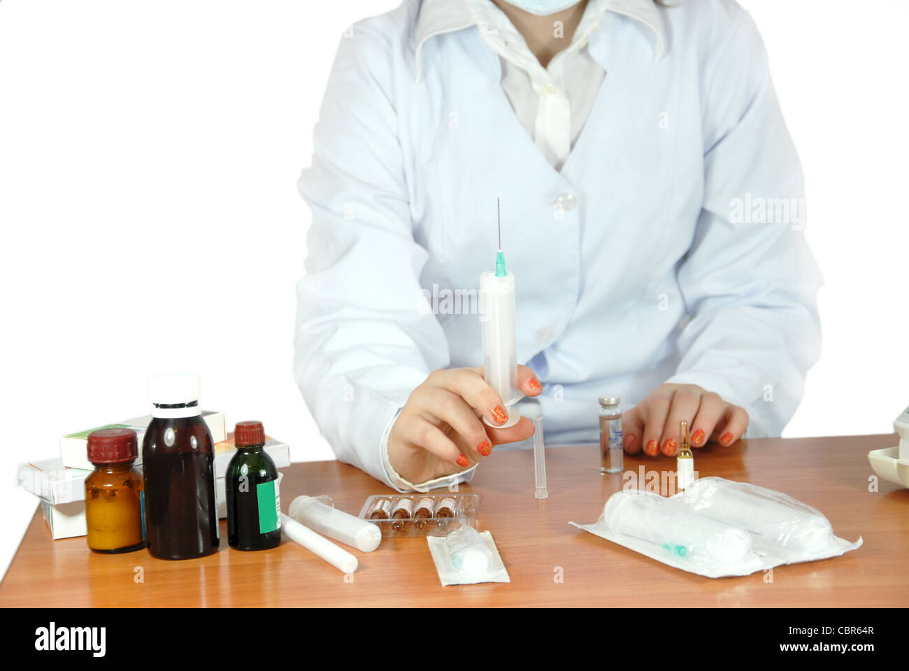 young doctor learns to do injections on personal experience Stock Photo