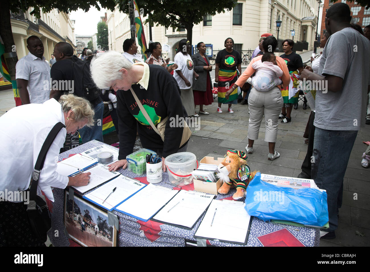 Signing petition Zimbabwe protest London Stock Photo