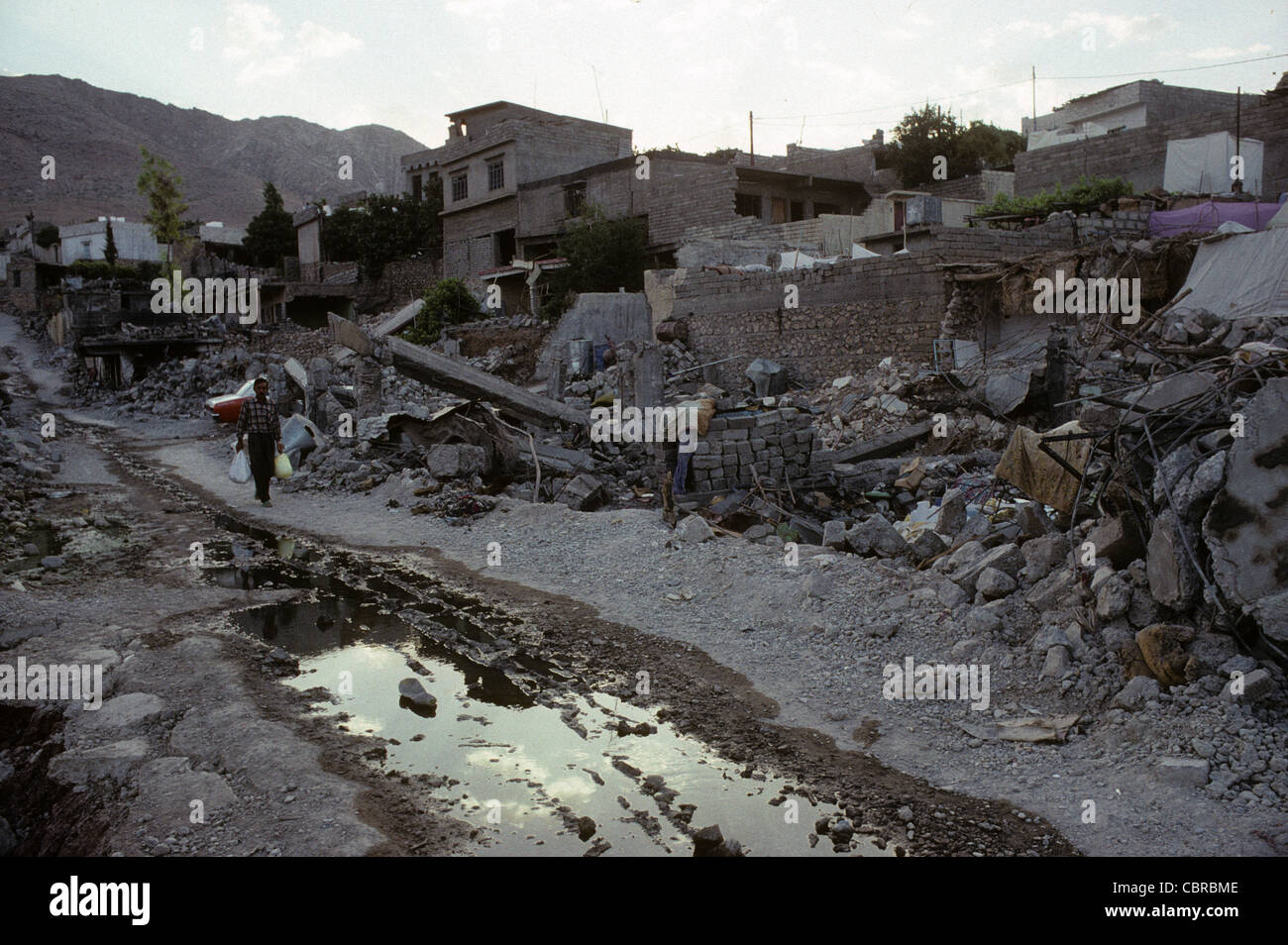 Kurdish city of Dohuk after fighting between Kurds and Saddam Hussein's army with bomb damage and burst water pies, sewage. Stock Photo