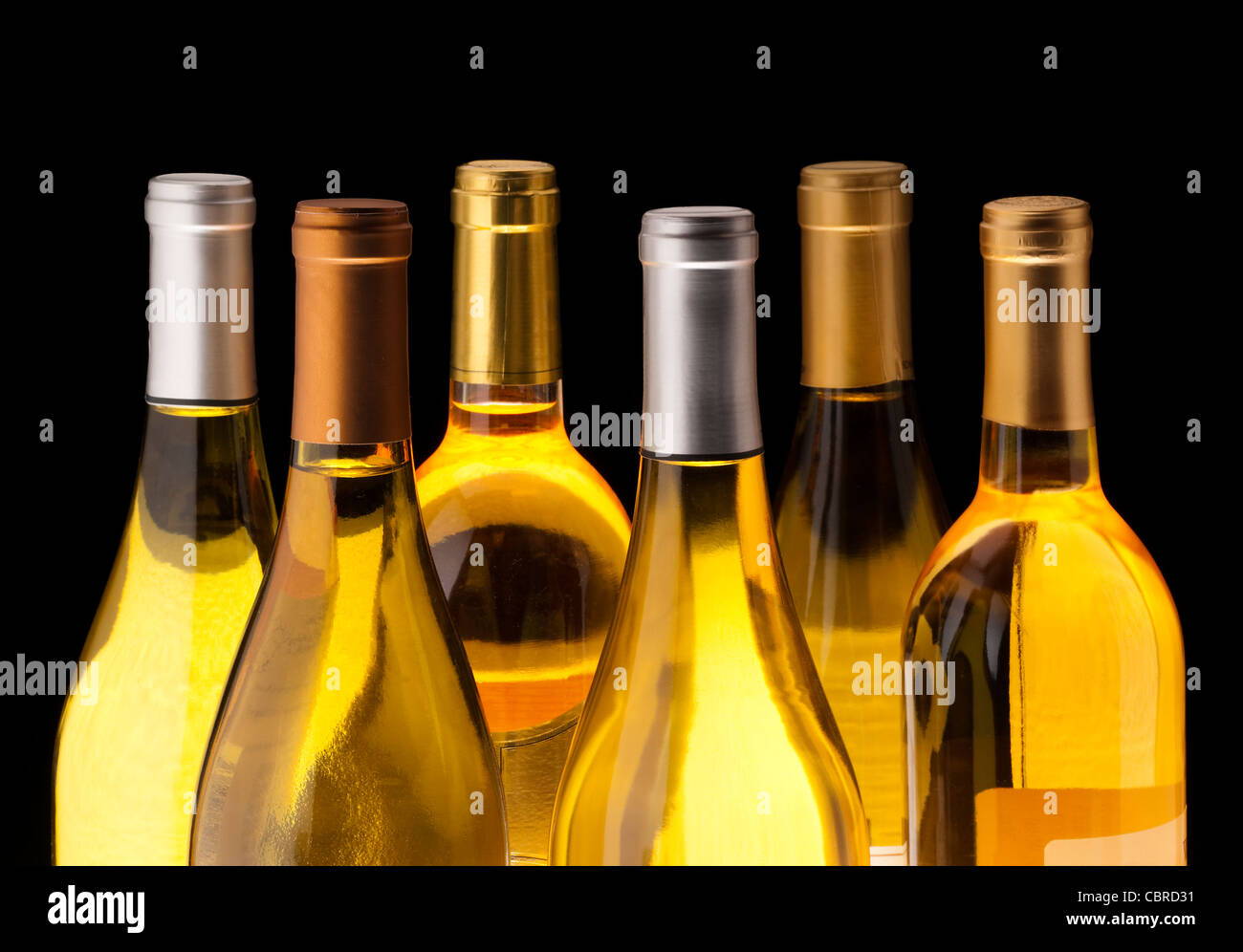 White wine bottles on black background Stock Photo