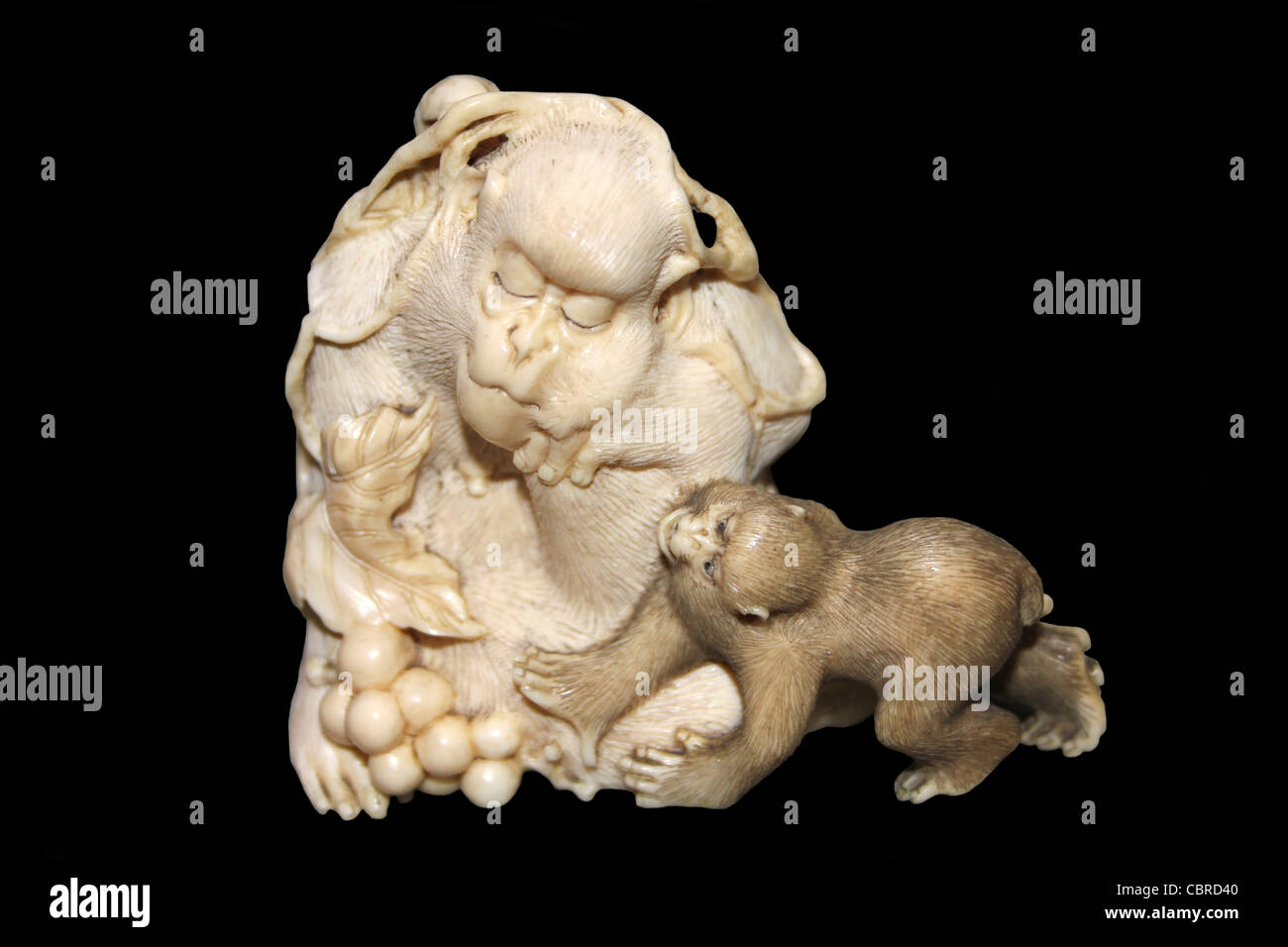 Carved Ivory Netsuke Showing Mischievous Monkeys Stock Photo