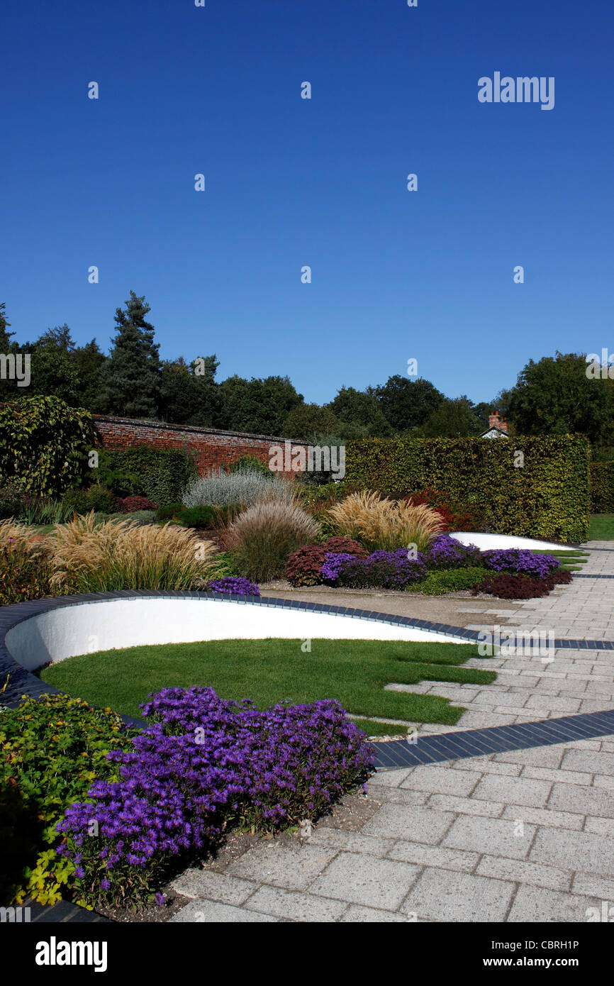 COLOURFUL AUTUMN FLOWER BEDS WITHIN THE WALLED GARDEN AT MARKS HALL IN