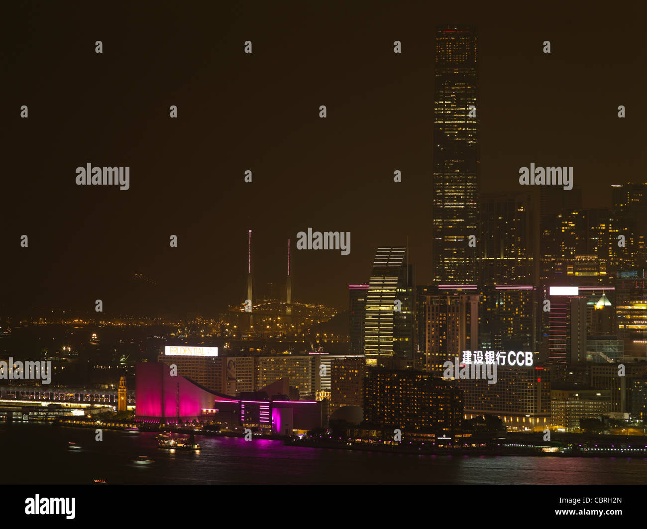 dh  TSIM SHA TSUI HONG KONG City Habour waterfront lights at night building ICC skyscraper HKCC international commerce centre cultural center Stock Photo